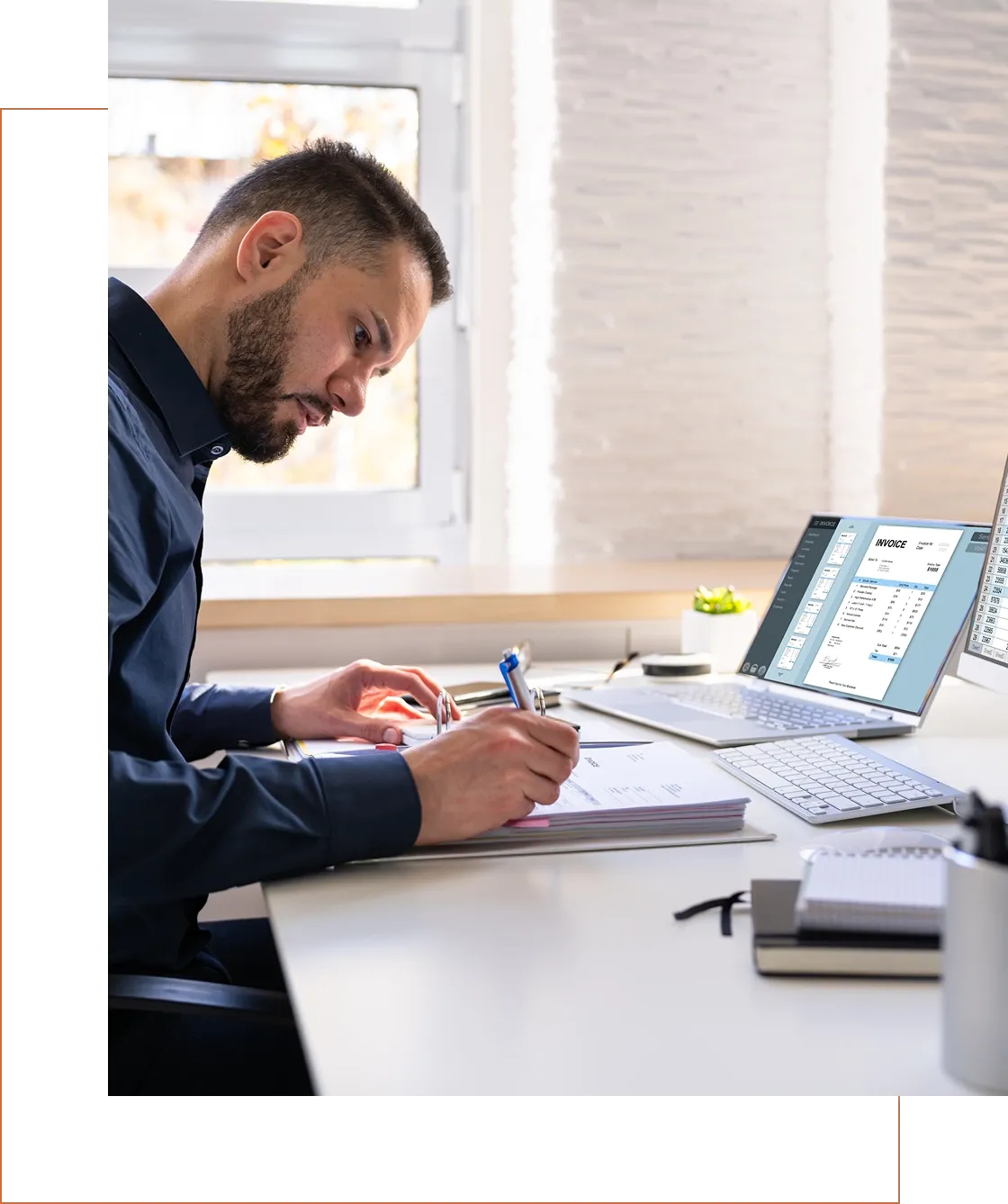 Man working at a desk with laptop