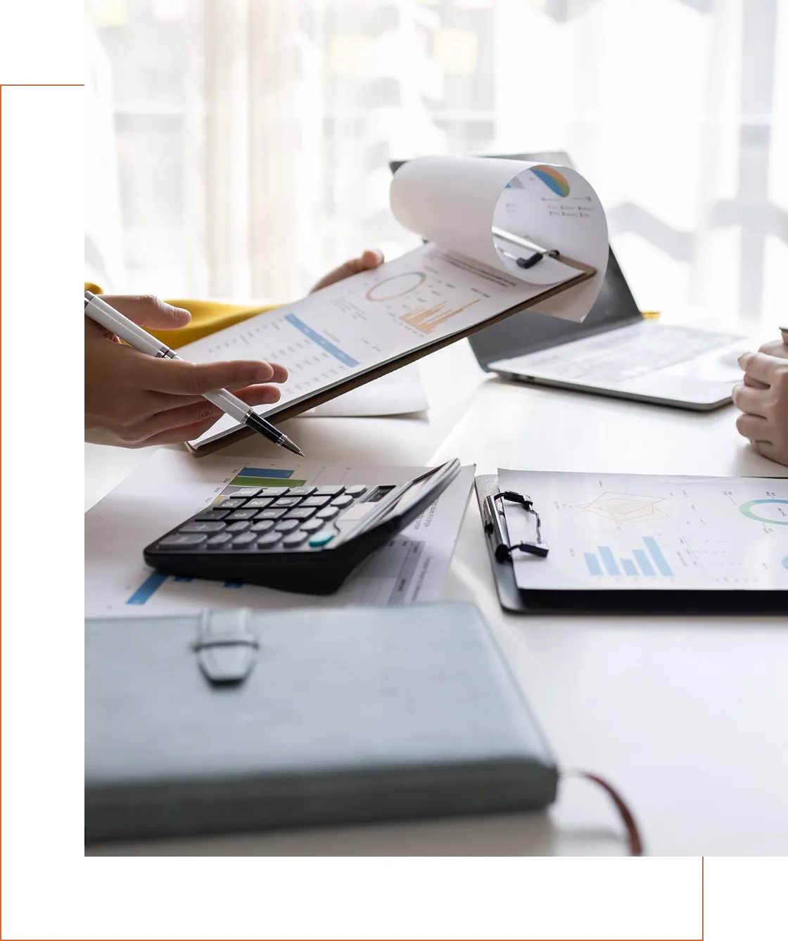 Business meeting with documents and calculator