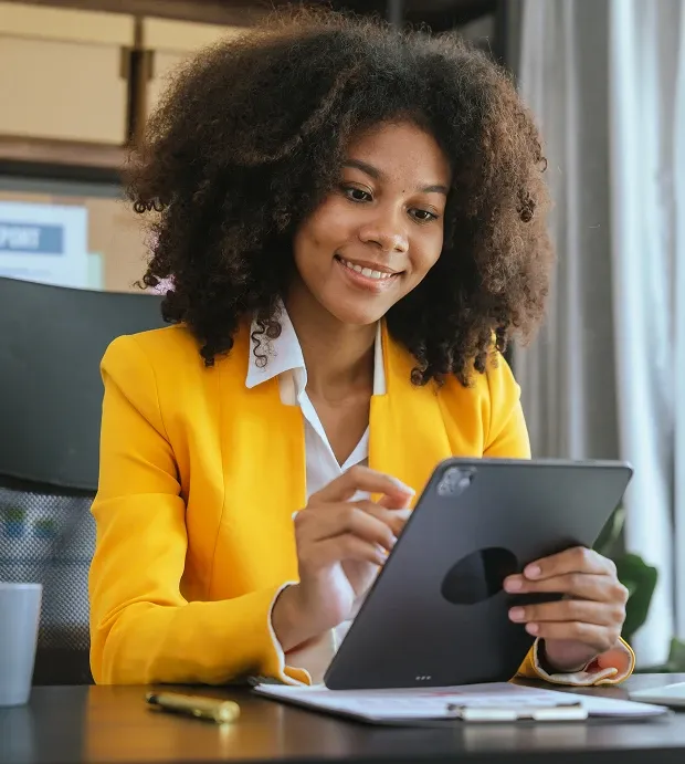 Professional woman reviewing information on a tablet