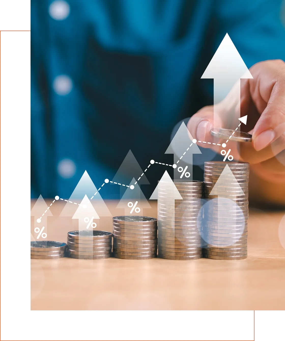 Stacked coins with arrows showing financial growth