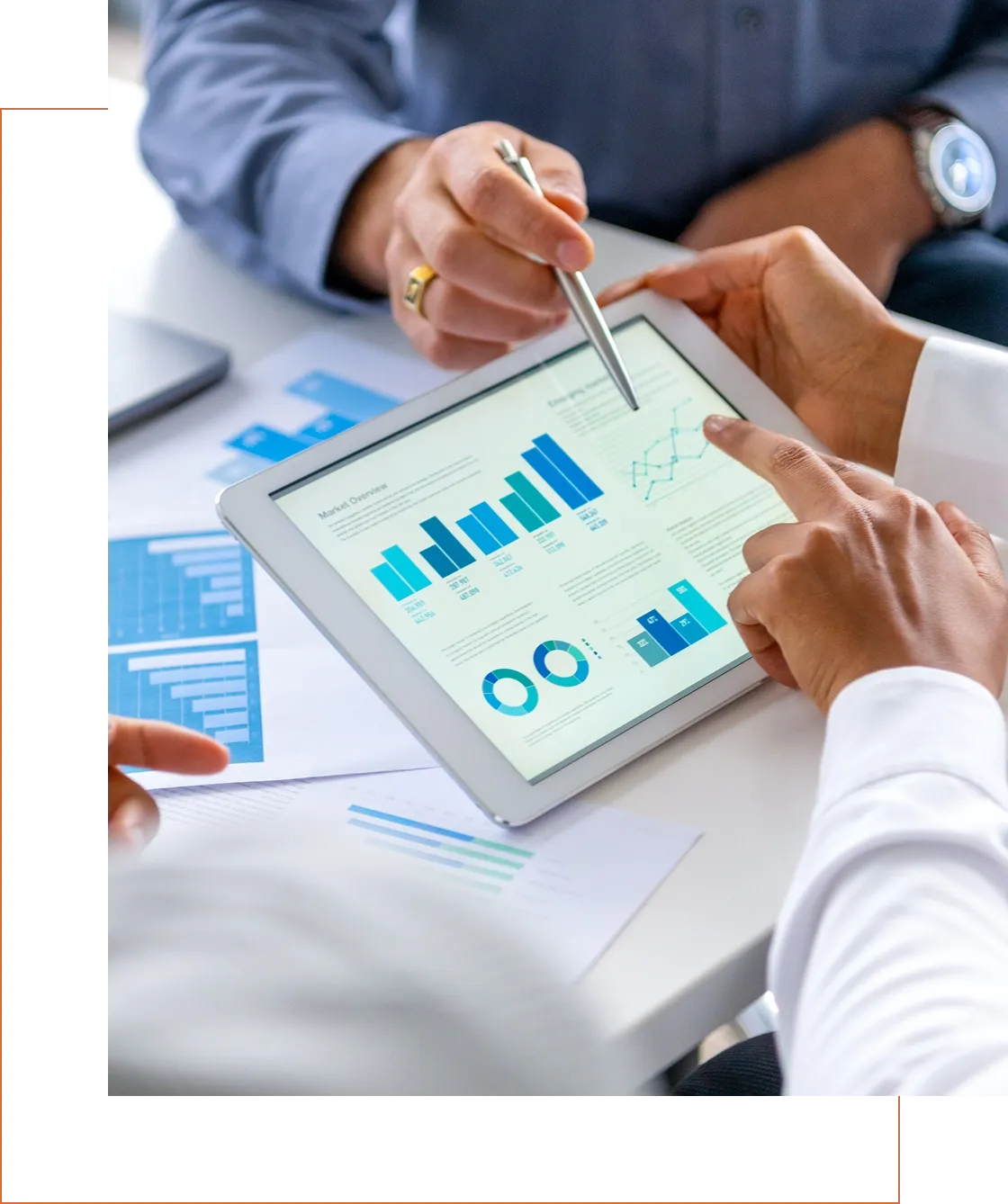 Tablet displaying graphs and charts in a meeting